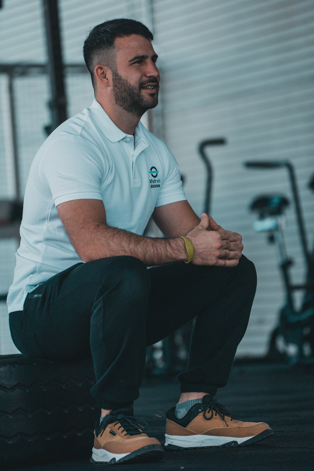 Turkish male head trainer in his 40s smiling in professional attire