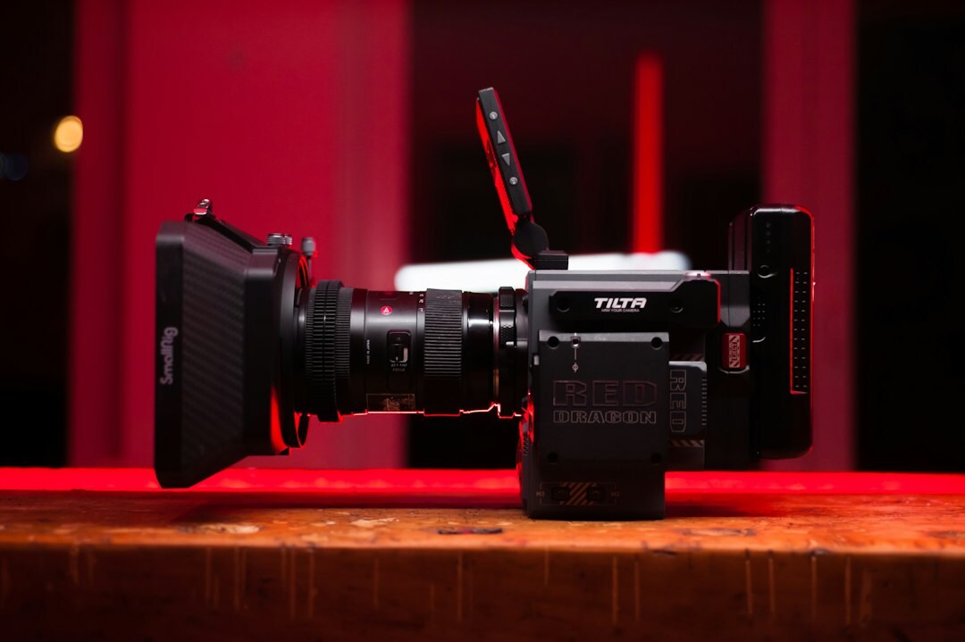 Close-up of professional broadcast camera and lighting equipment on a TV set