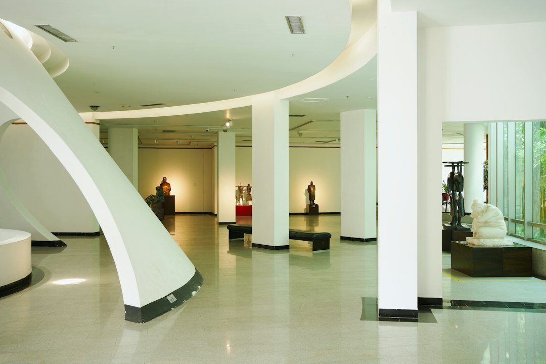 Modern office reception area with seating and plants